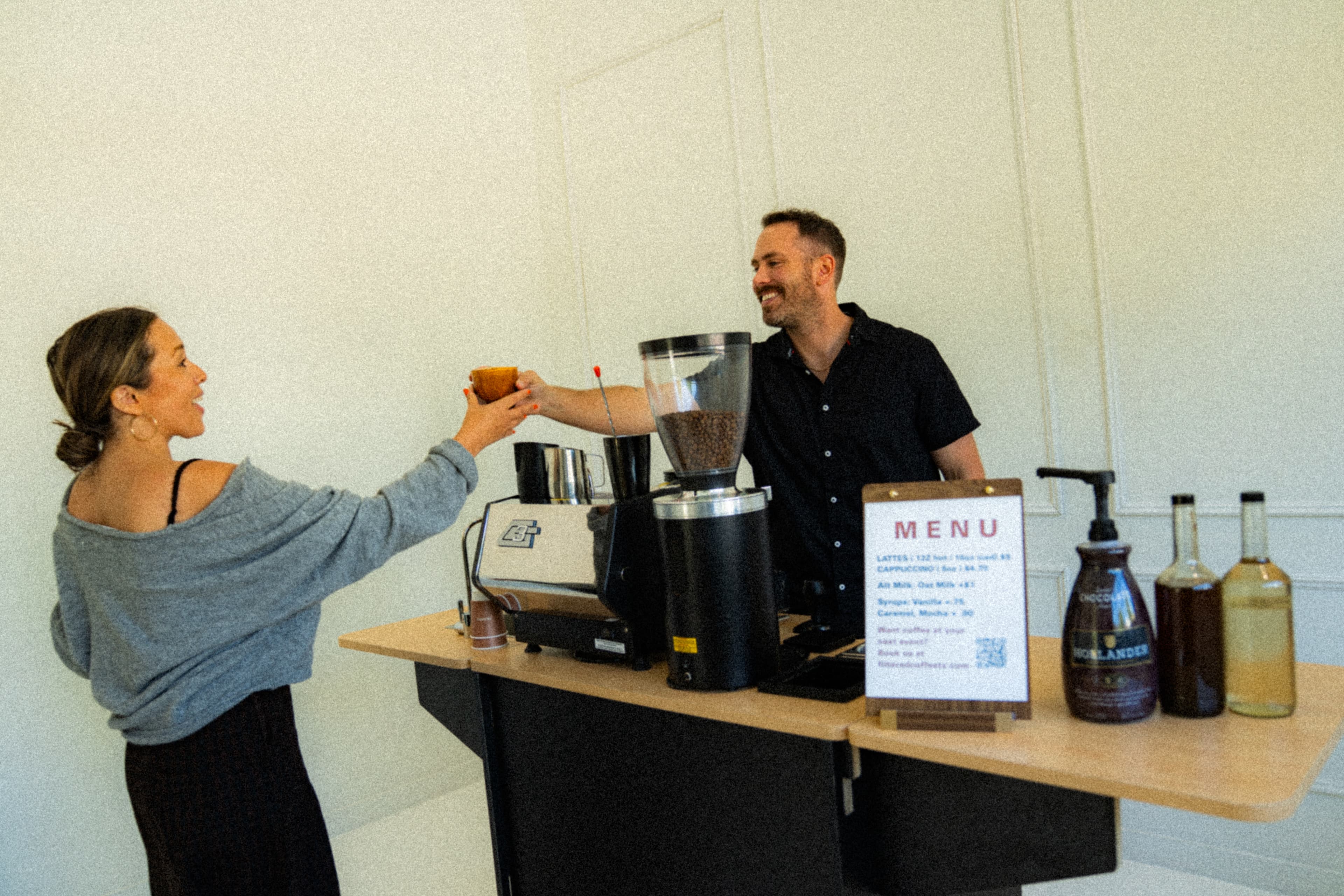 Filtered barista serving a guest